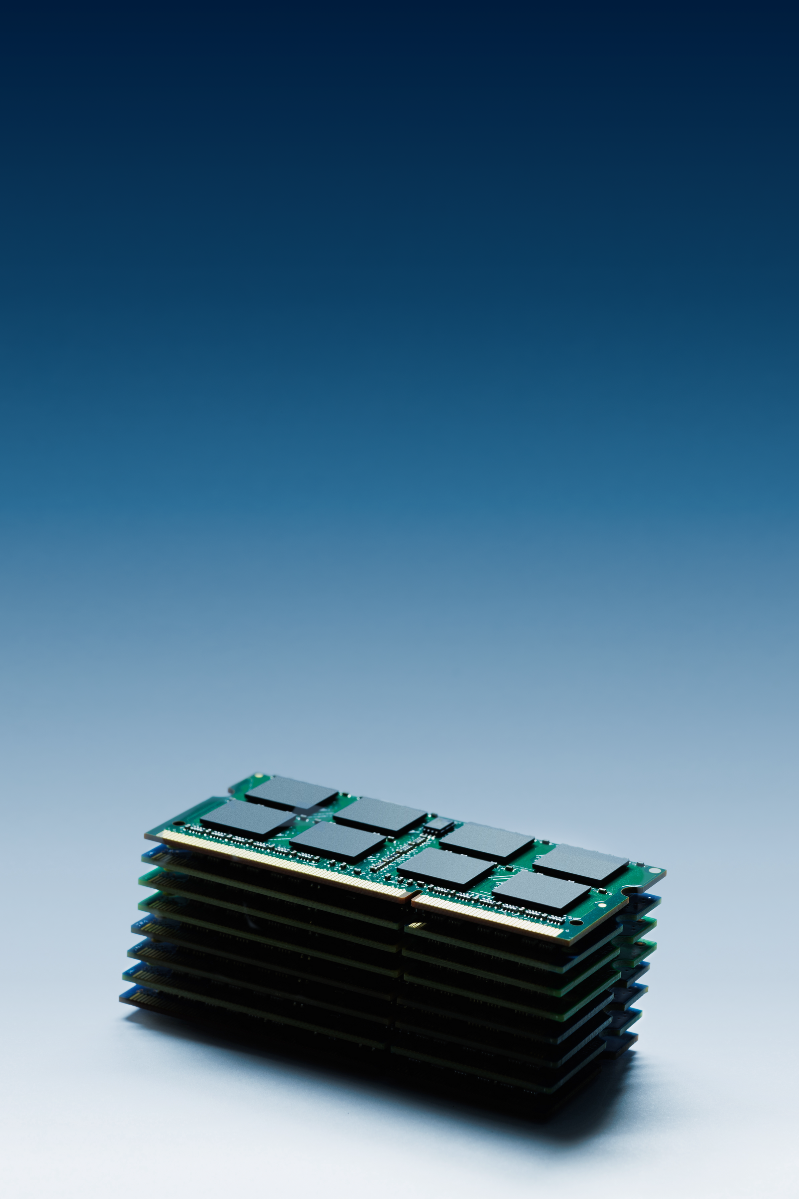 A stack of DRAM memory modules on a deep-blue background